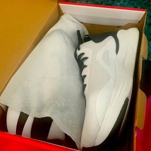 White and black tennis shoes